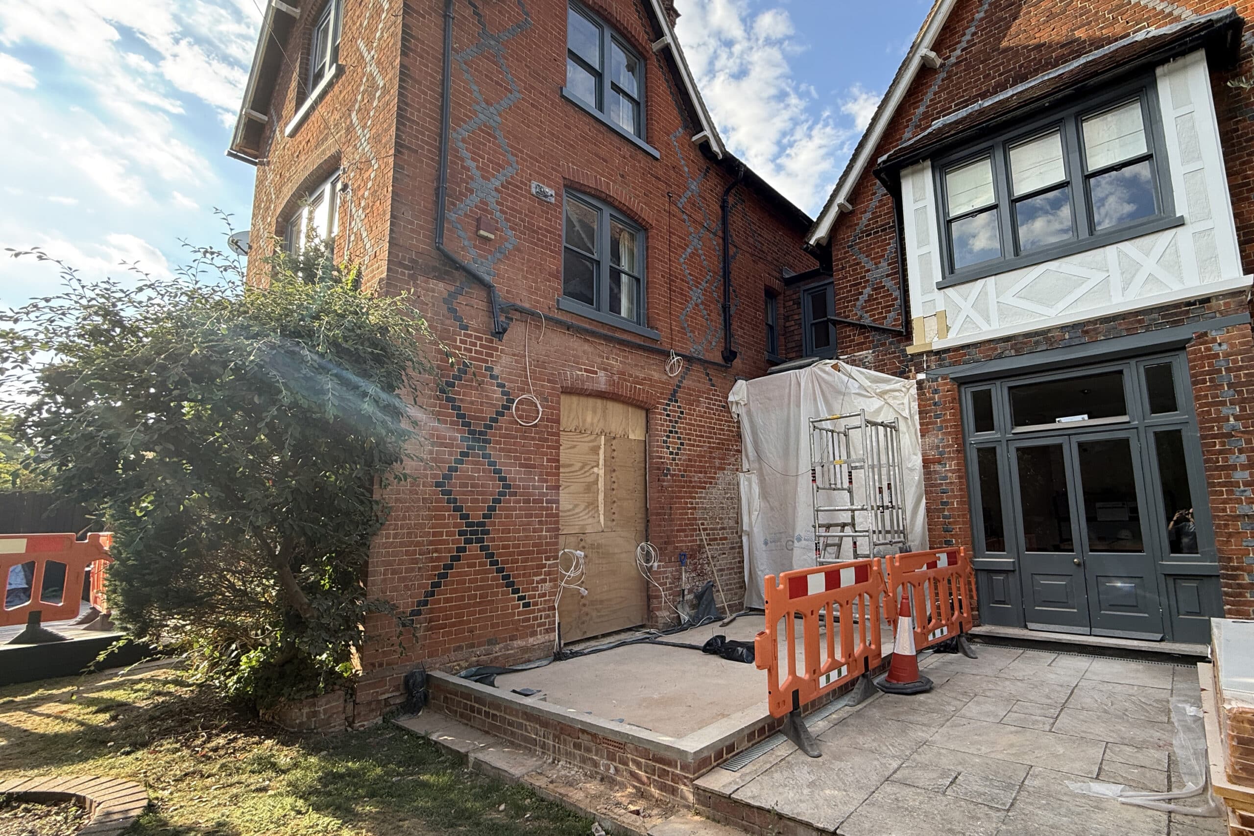 Site photo showing the original conservatory removed and the new base built according to design drawings.