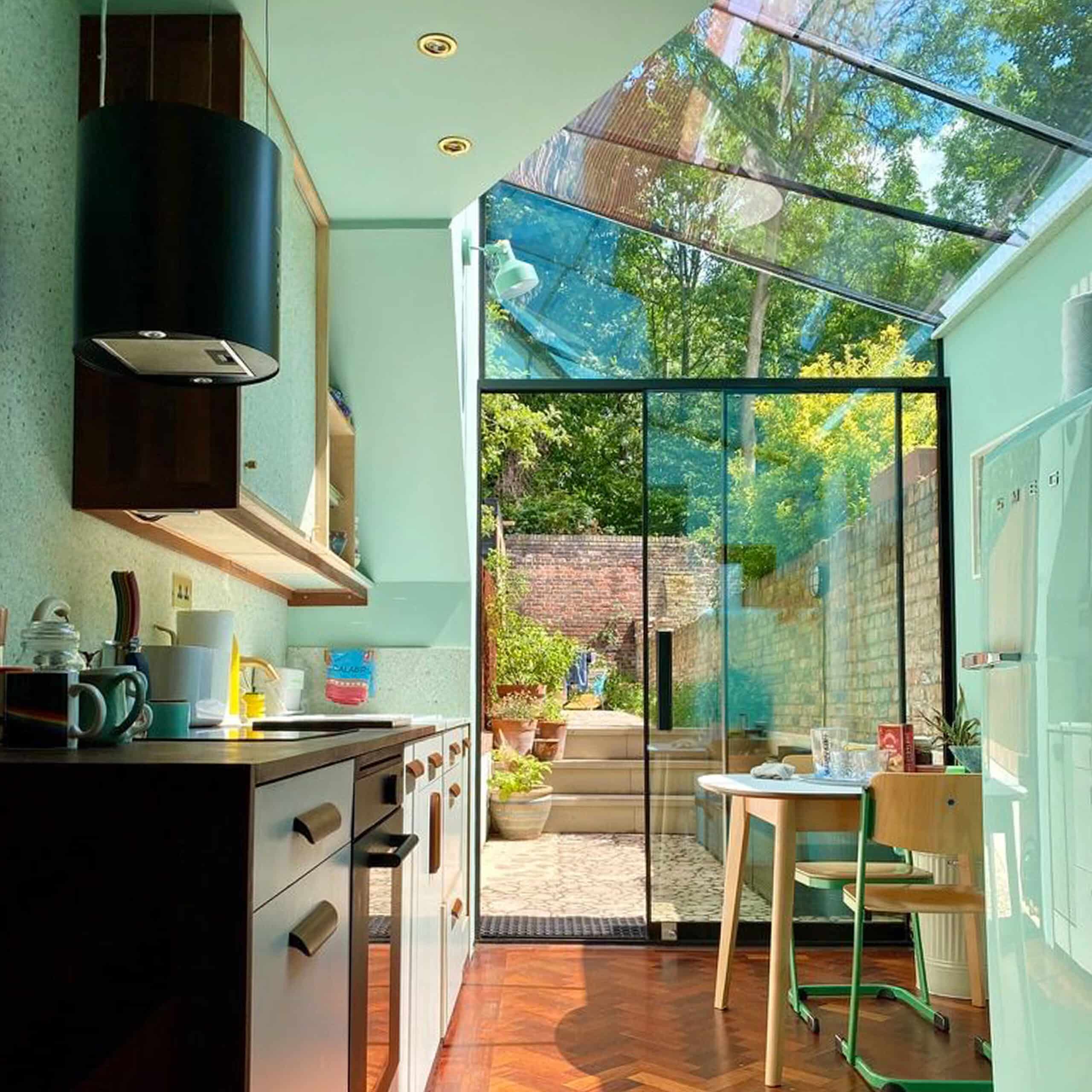 Compact London Glass Extension with Angled Glazed Roof for New Kitchen