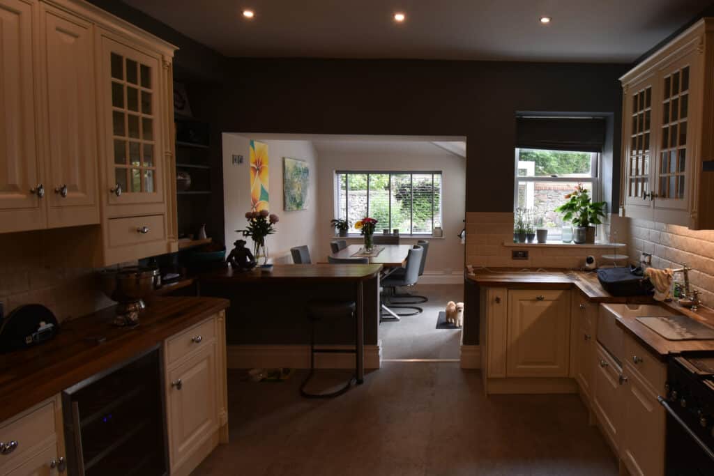 Interior view of the old kitchen extension in Bristol showing a dark, enclosed space before the new glass extension was built.