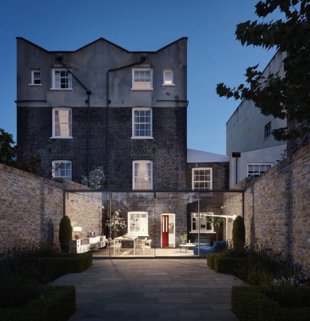 Contemporary glass extension featuring full-height sliding doors, creating a seamless flow between indoor living space and landscaped garden 1