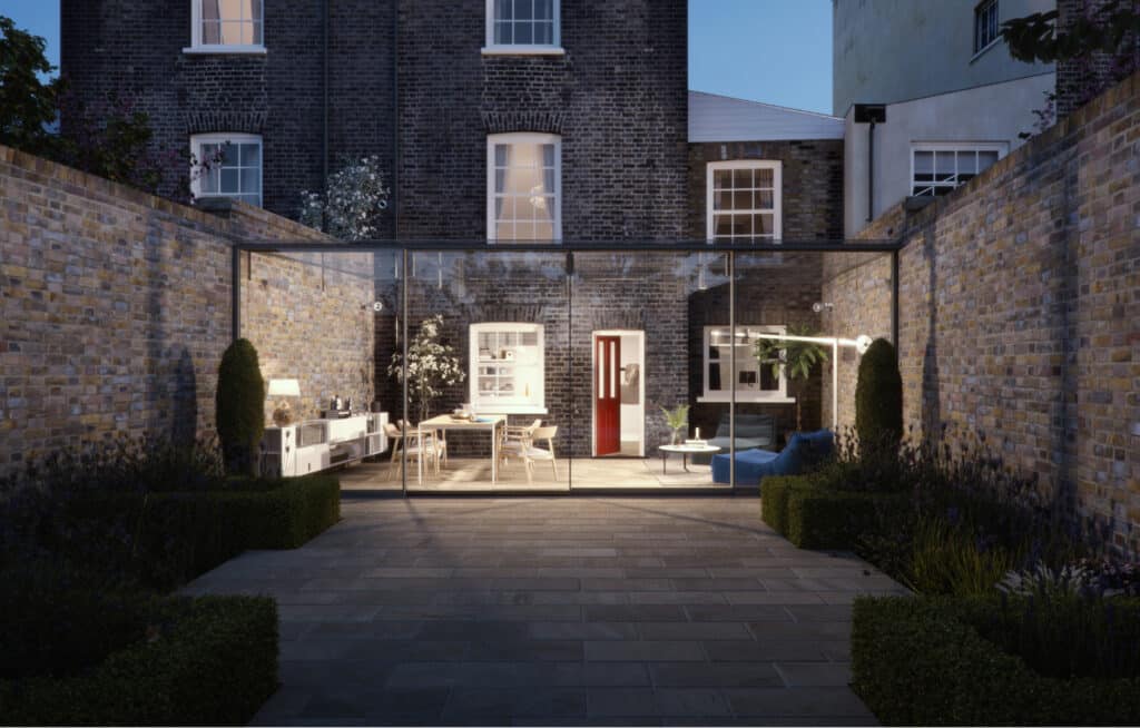 Contemporary glass extension featuring full-height sliding doors, creating a seamless flow between indoor living space and landscaped garden