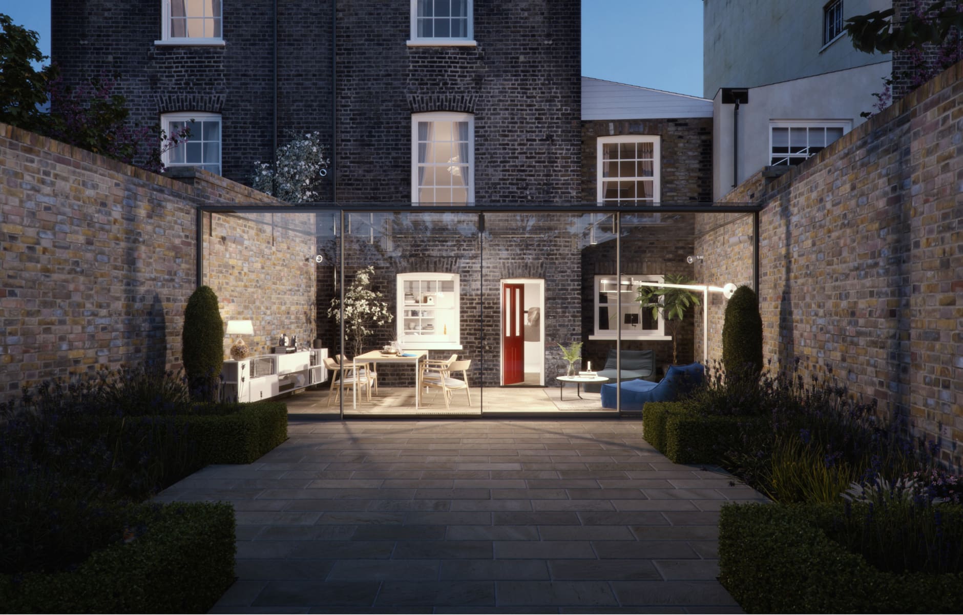 Contemporary glass extension featuring full-height sliding doors, creating a seamless flow between indoor living space and landscaped garden