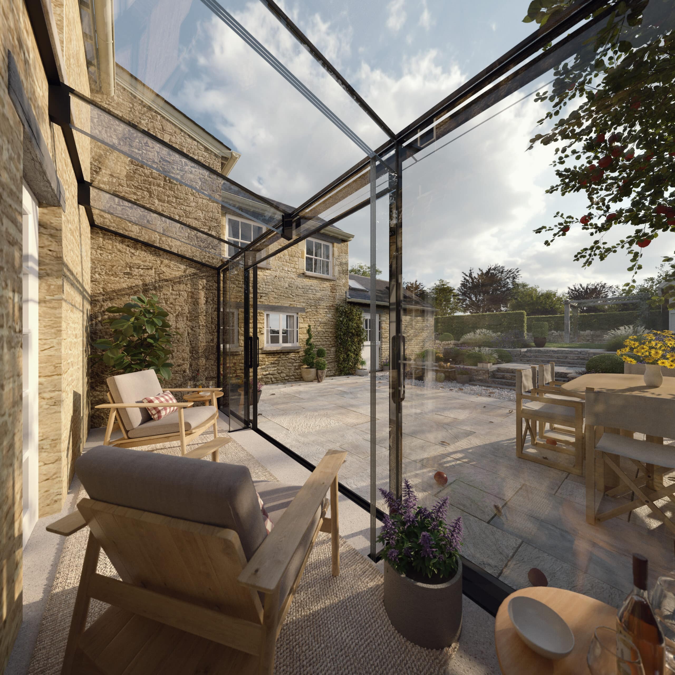 Sunlit contemporary glass room attached to a traditional Cotswold stone cottage with views across the garden.