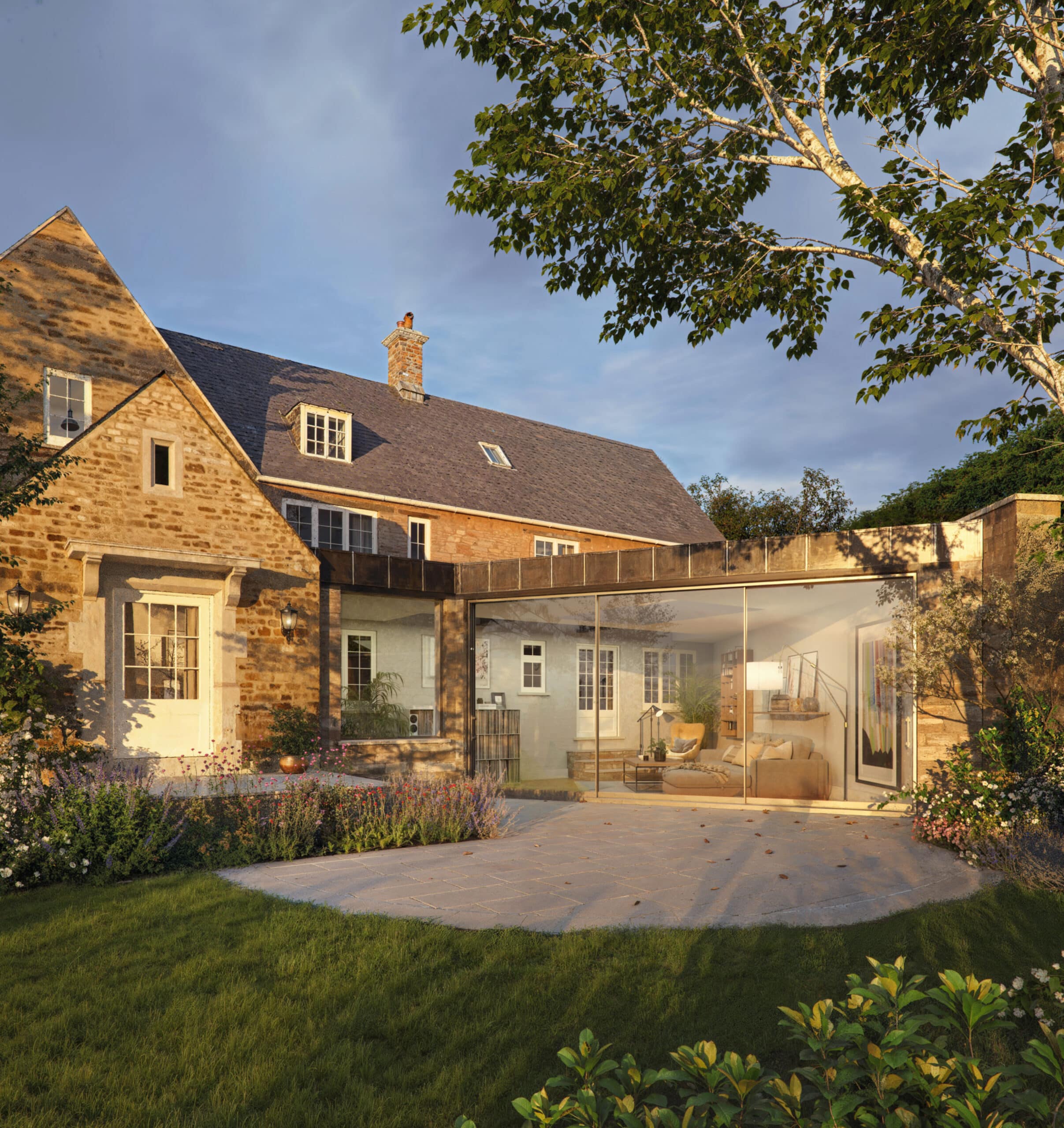 Ultra-slim frameless sliding door system installed in a luxury Cotswolds extension