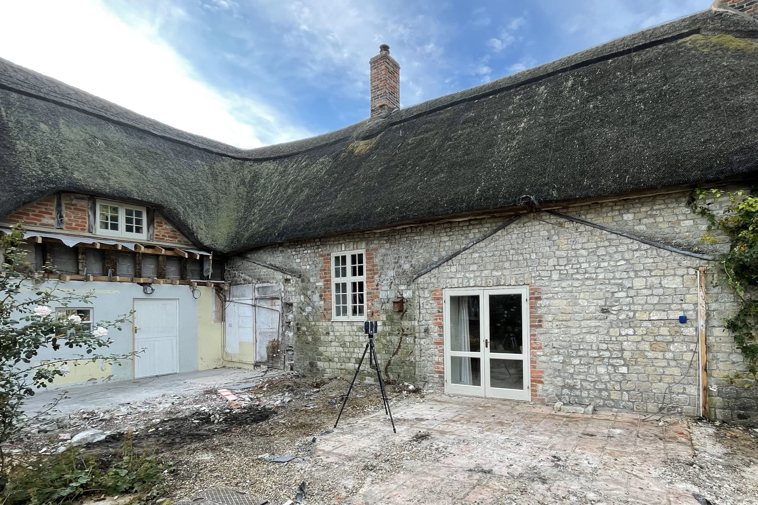Cleared site ready for 3D laser scan before installation of frameless glass extension.